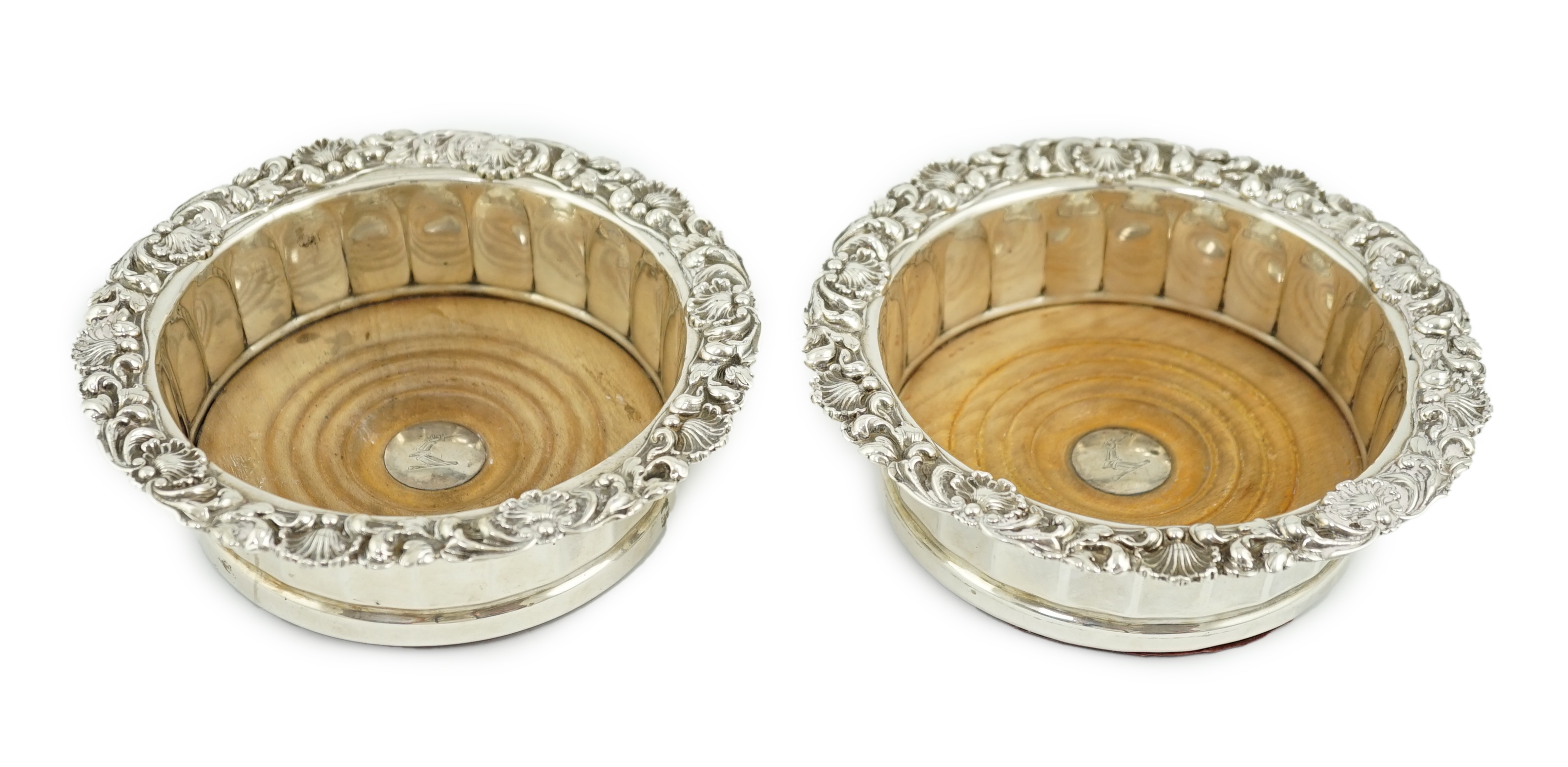 A pair of George III silver mounted wine coasters, by John & Thomas Settle Gunn & Co